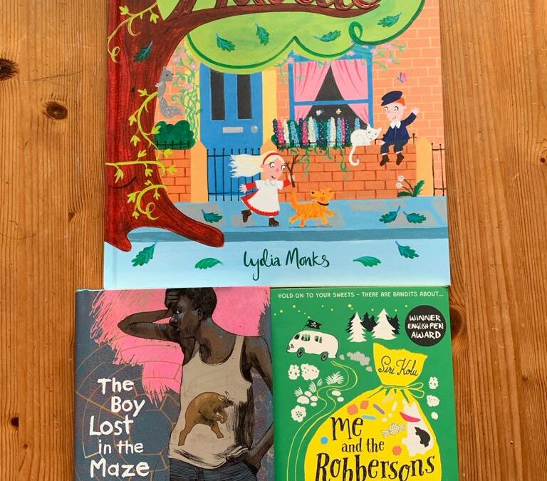 Picture that shows the three covers for the nominated books. 'Adoette' at the top and 'The Boy Lost in the Maze' next to 'Me and the Robbersons' under it.